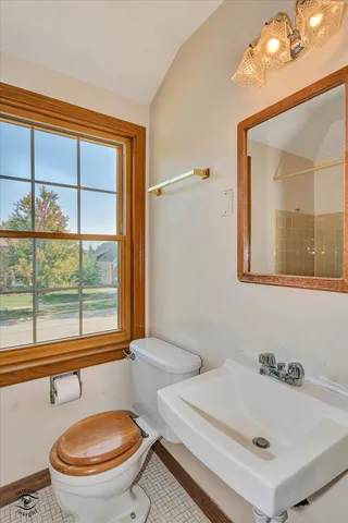 a bathroom with a tub and a window