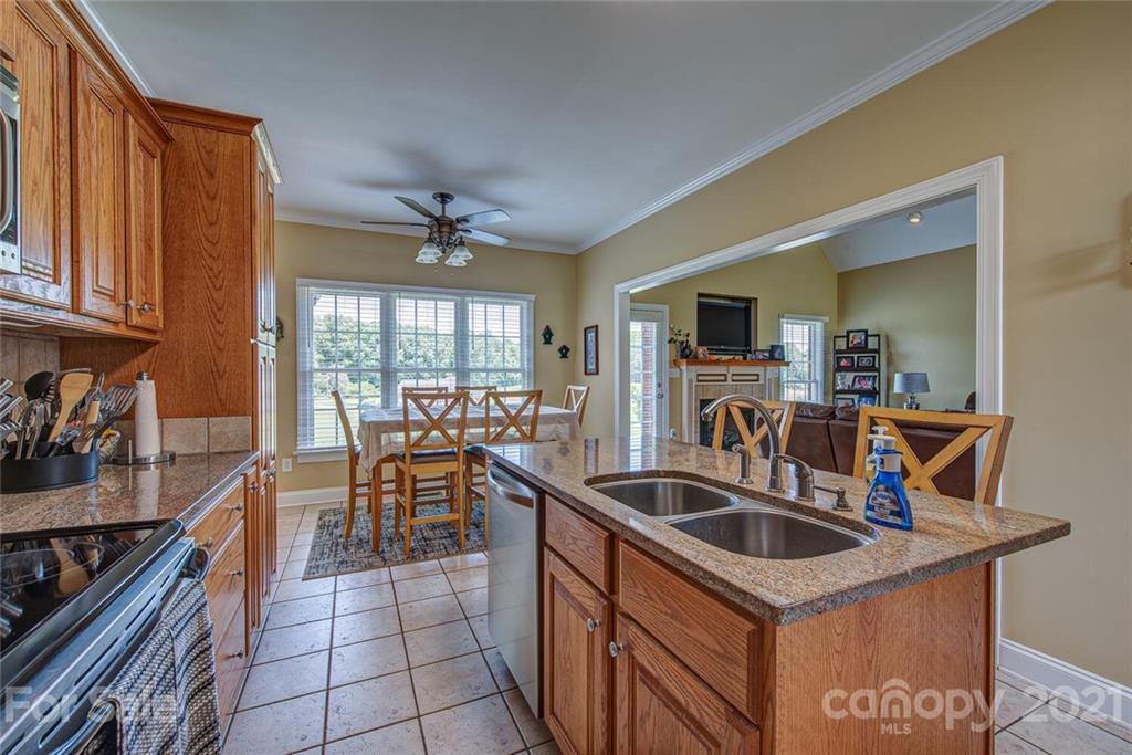936 Ferguson Ridge Road Gastonia, NC 28052 - Photo 11 of 30 a kitchen that has a sink and a stove in it
