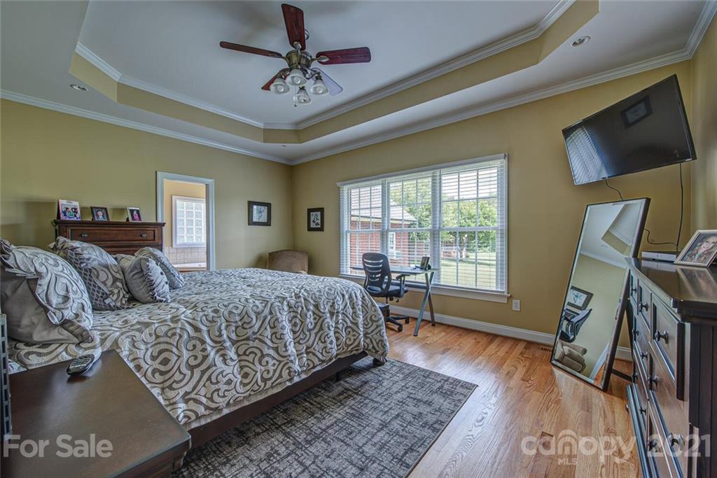 936 Ferguson Ridge Road Gastonia, NC 28052 - Photo 15 of 30 a bedroom with a bed a couch and large window