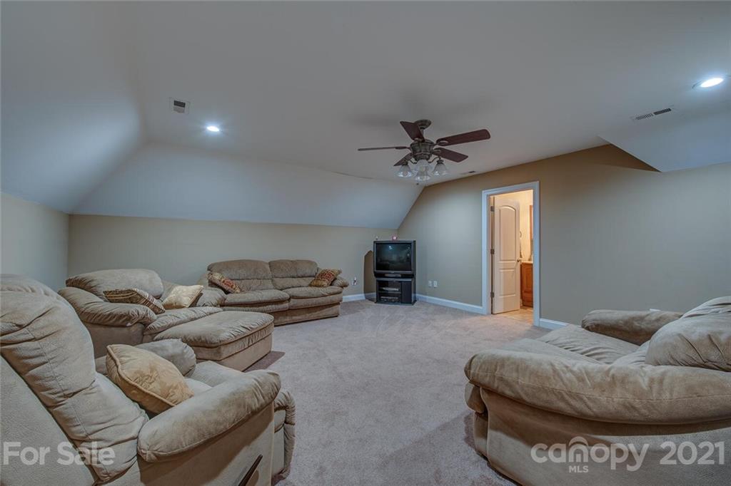 936 Ferguson Ridge Road Gastonia, NC 28052 - Photo 19 of 30 a living room with furniture and a ceiling fan