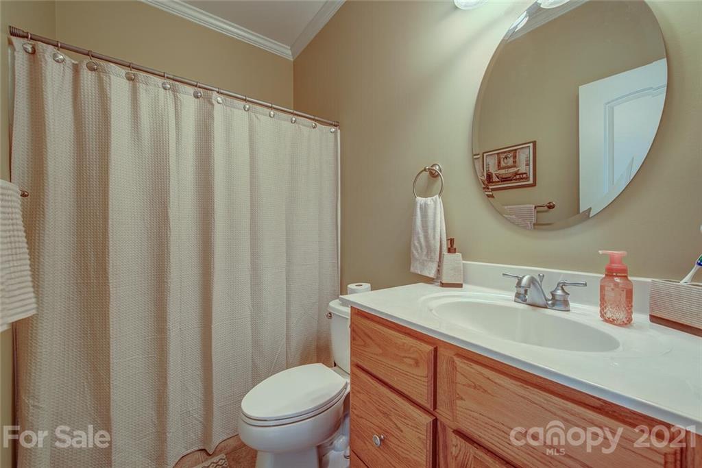936 Ferguson Ridge Road Gastonia, NC 28052 - Photo 22 of 30 a bathroom with a sink a toilet and a mirror