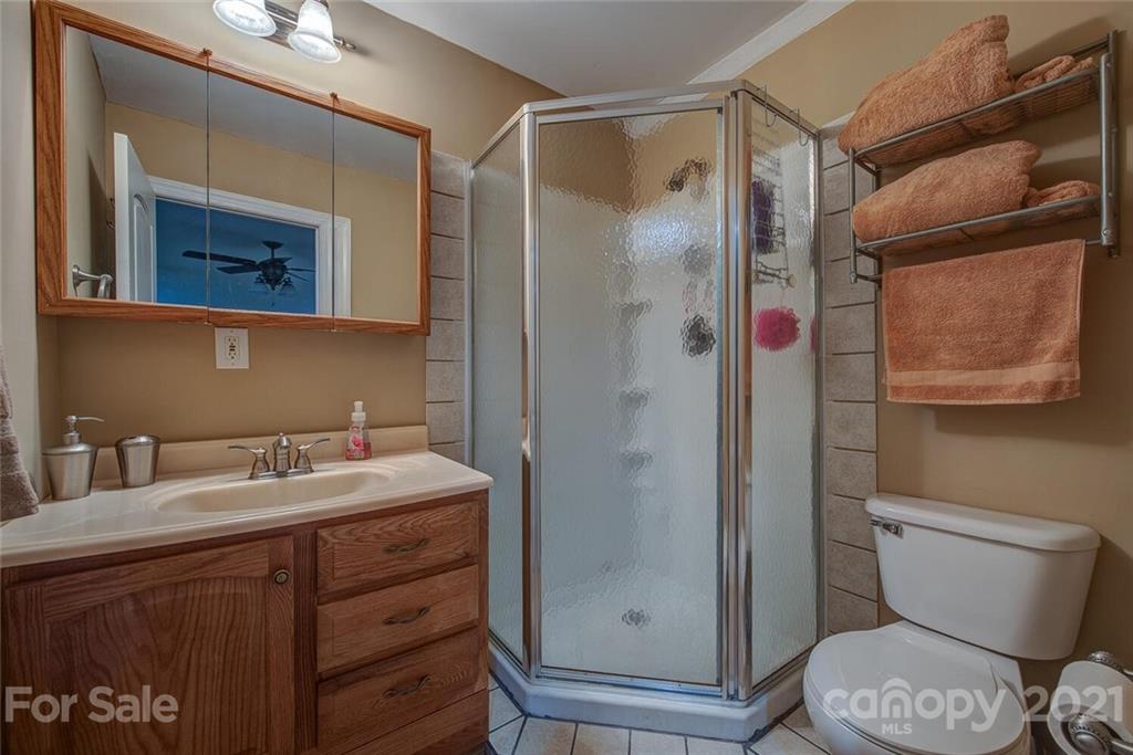 936 Ferguson Ridge Road Gastonia, NC 28052 - Photo 23 of 30 a bathroom with a sink toilet and shower