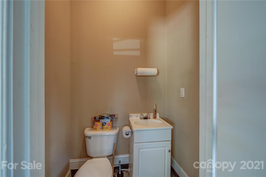 936 Ferguson Ridge Road Gastonia, NC 28052 - Photo 27 of 30 a bathroom with a sink mirror and toilet