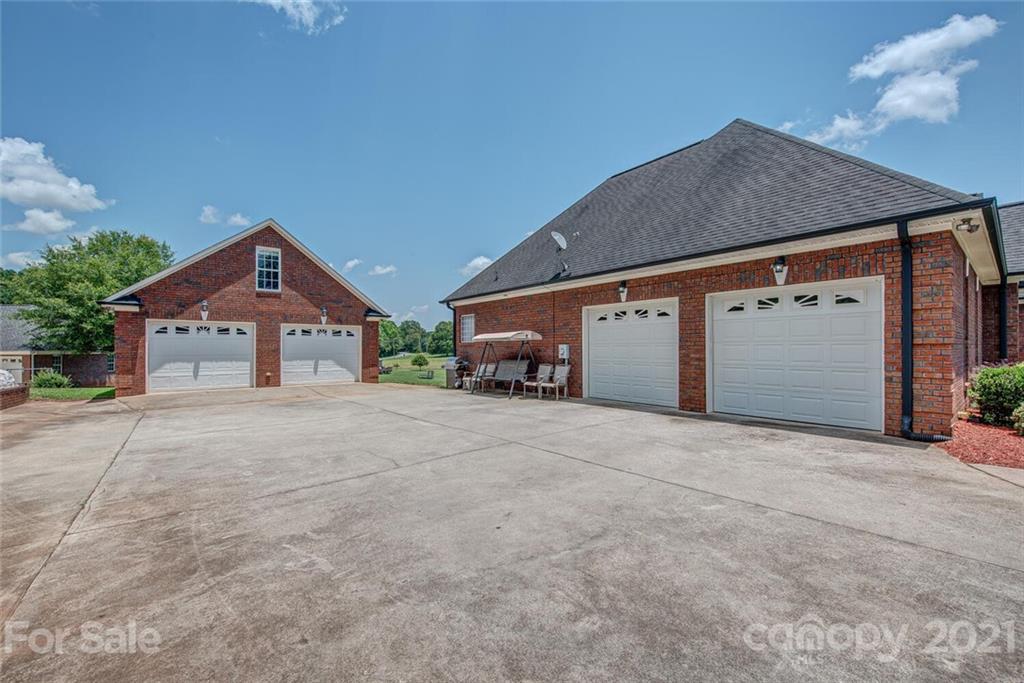 936 Ferguson Ridge Road Gastonia, NC 28052 - Photo 28 of 30 a front view of a house with a yard and garage