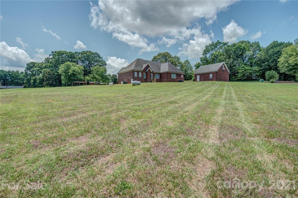 936 Ferguson Ridge Road Gastonia, NC 28052 - Photo 30 of 30 a view of an house with backyard space and garden