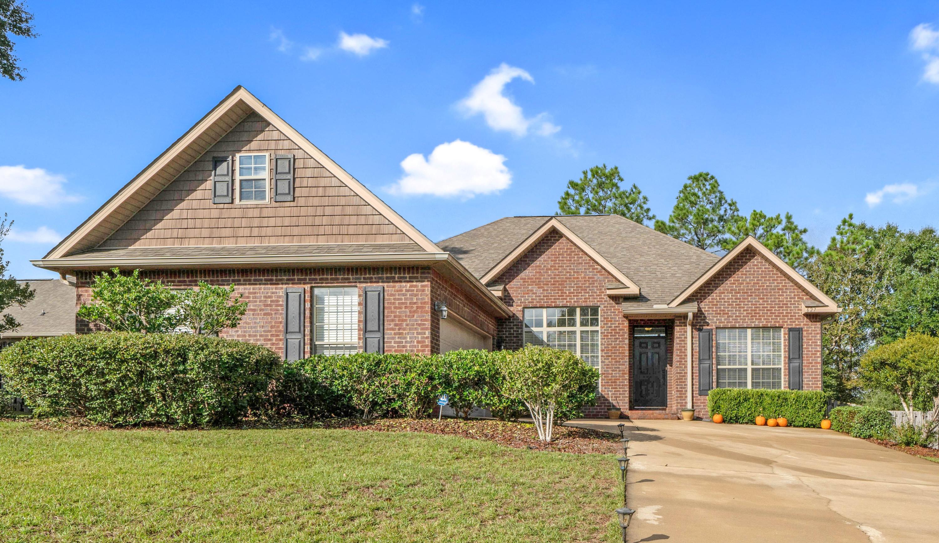 627 Red Fern Road Crestview, FL 32536 - Photo 1 of 29 a front view of a house with a yard