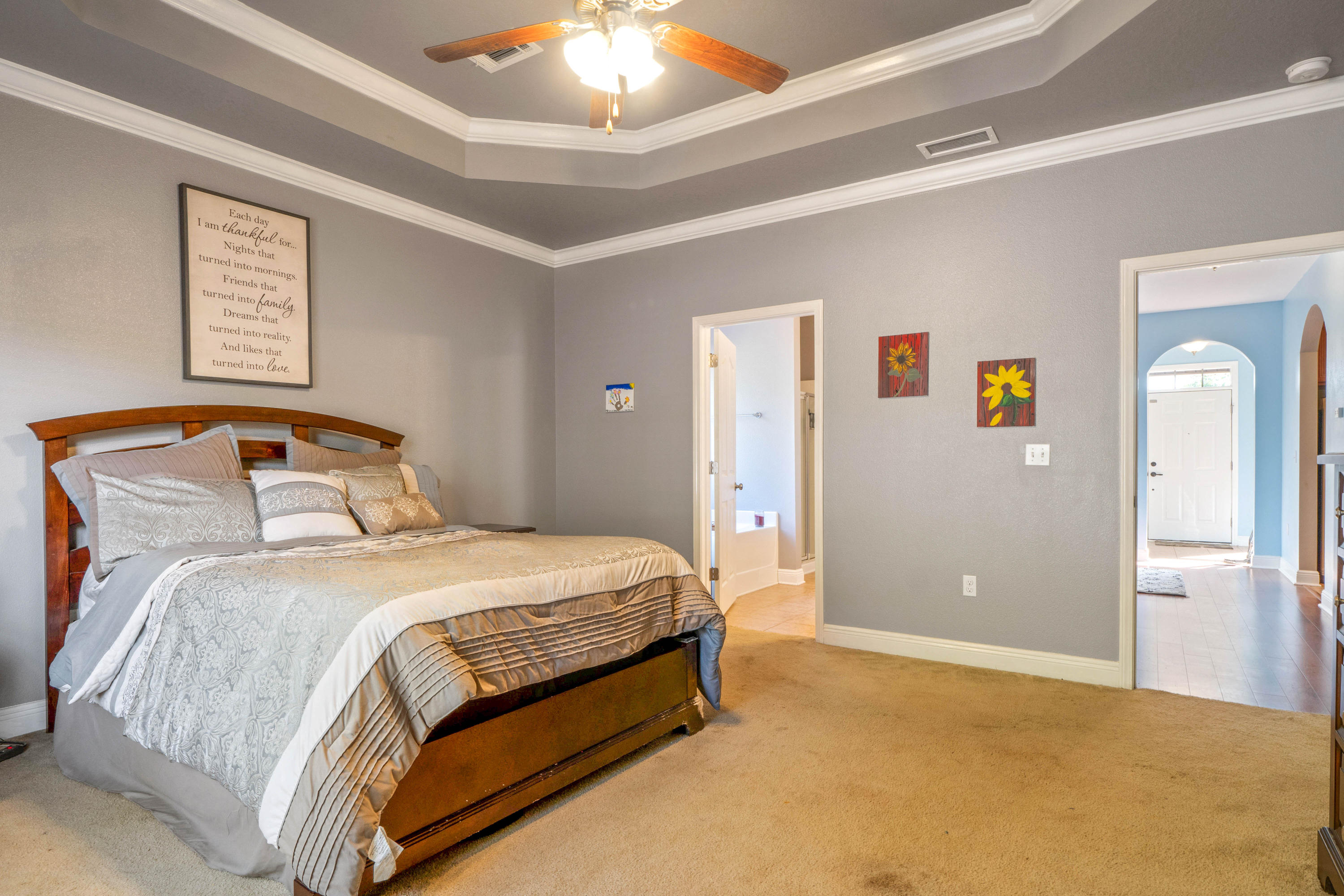 627 Red Fern Road Crestview, FL 32536 - Photo 18 of 29 a bedroom with a bed and painting on the wall