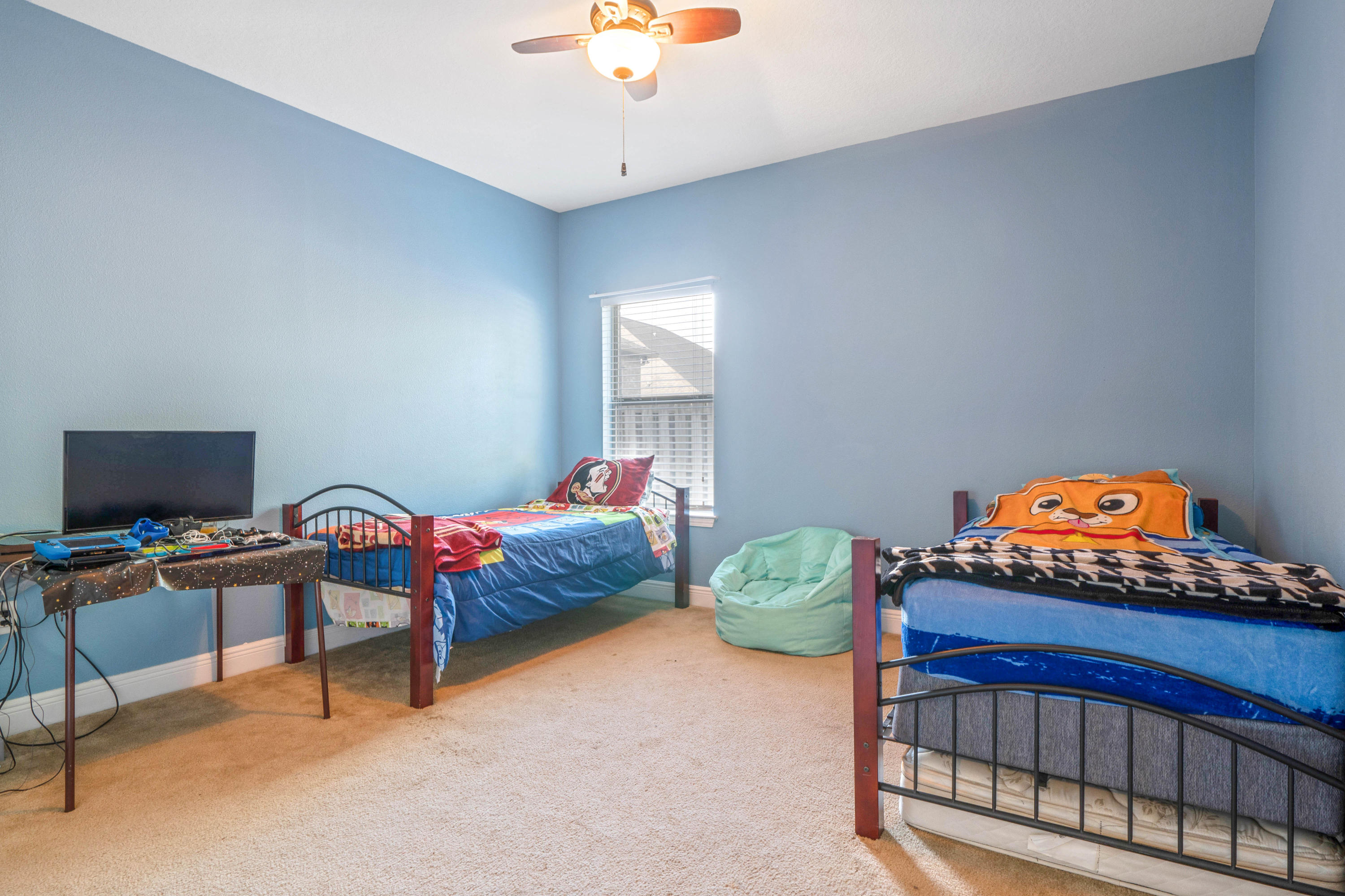 627 Red Fern Road Crestview, FL 32536 - Photo 22 of 29 a bedroom with a bed and a window