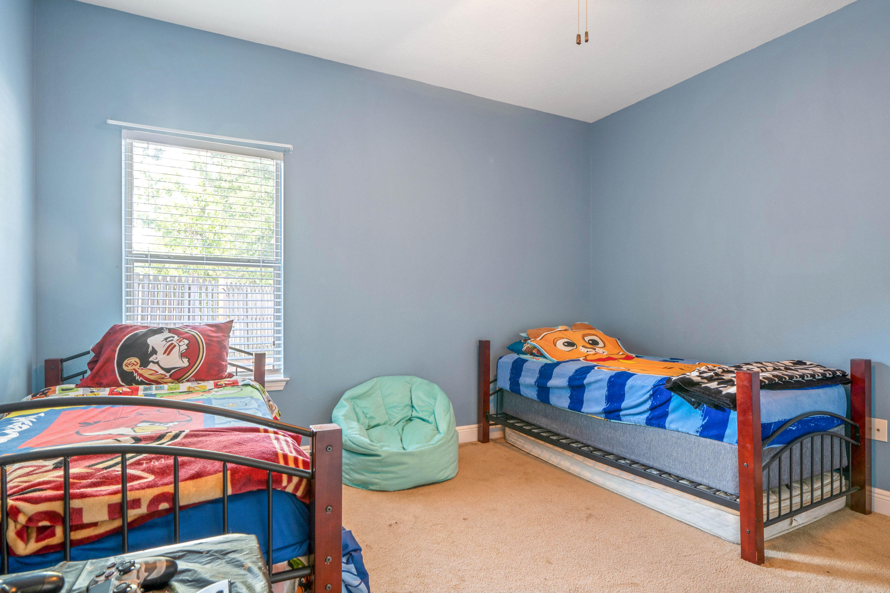 627 Red Fern Road Crestview, FL 32536 - Photo 23 of 29 a bedroom with bed and a window