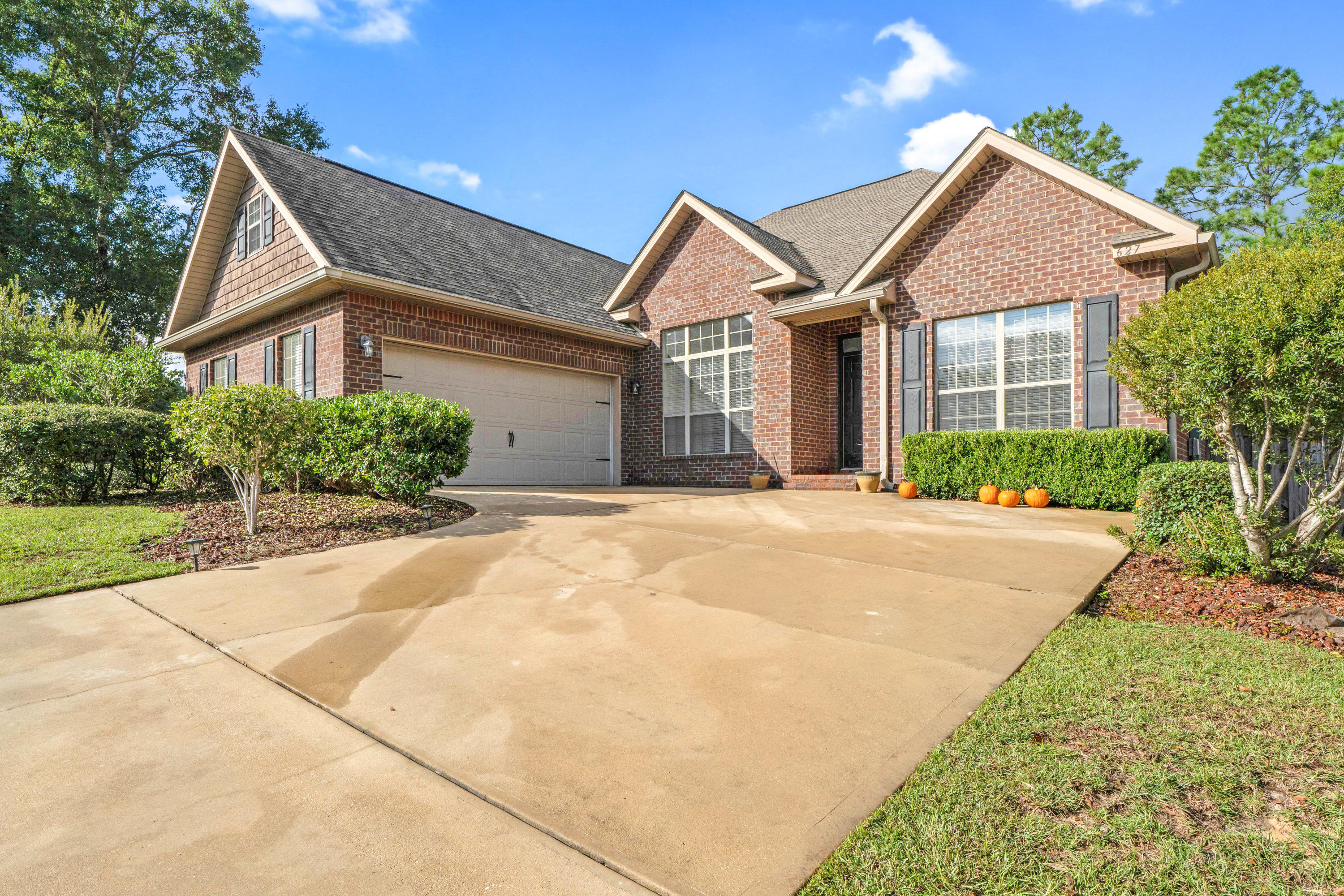 627 Red Fern Road Crestview, FL 32536 - Photo 29 of 29 a front view of a house with a yard and garage