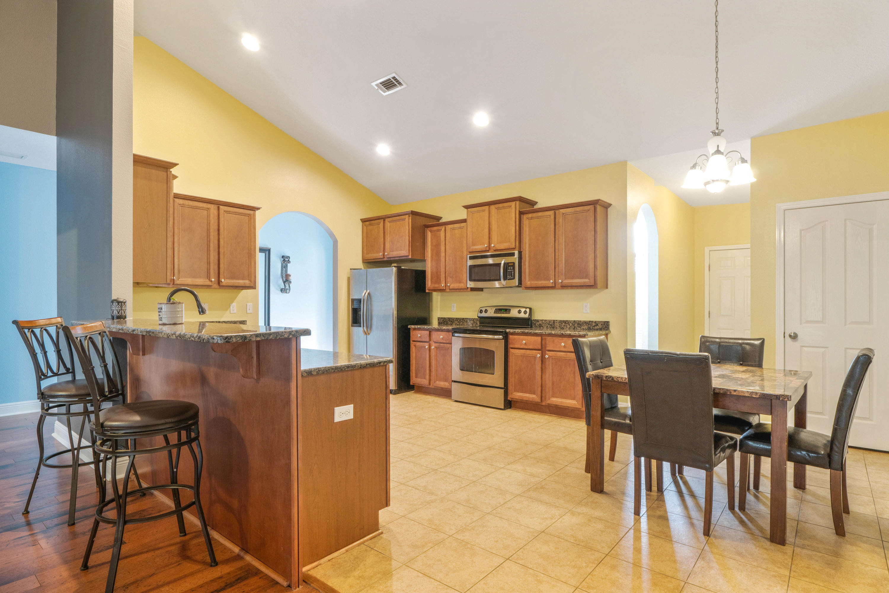 627 Red Fern Road Crestview, FL 32536 - Photo 5 of 29 a view of kitchen with stainless steel appliances granite countertop dining table and chairs
