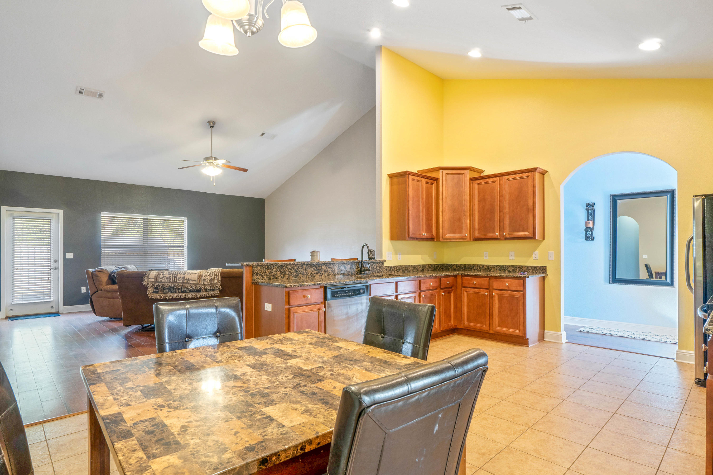 627 Red Fern Road Crestview, FL 32536 - Photo 6 of 29 a kitchen that has a table and chairs in it