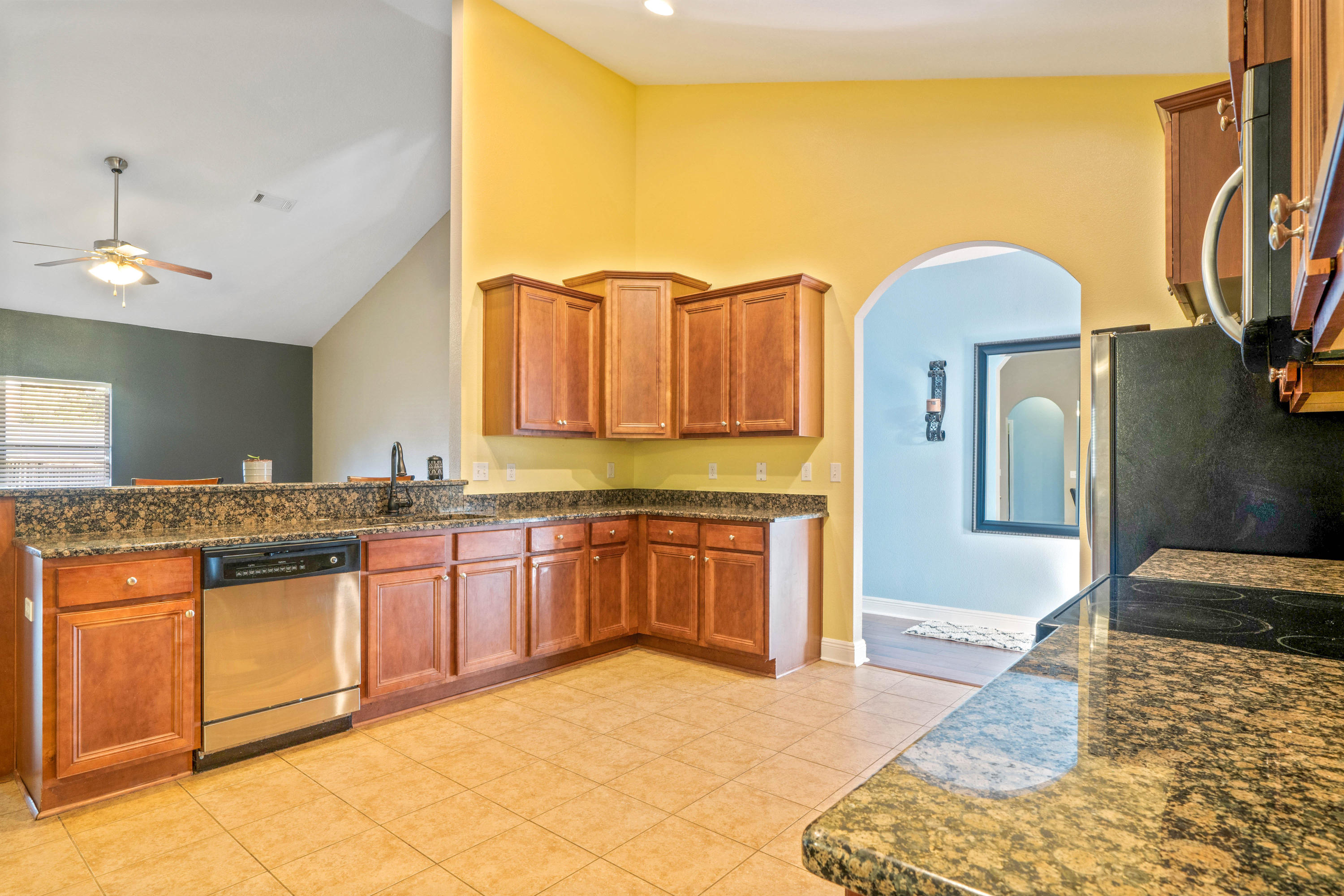 627 Red Fern Road Crestview, FL 32536 - Photo 7 of 29 a spacious bathroom with a granite countertop sink and a mirror