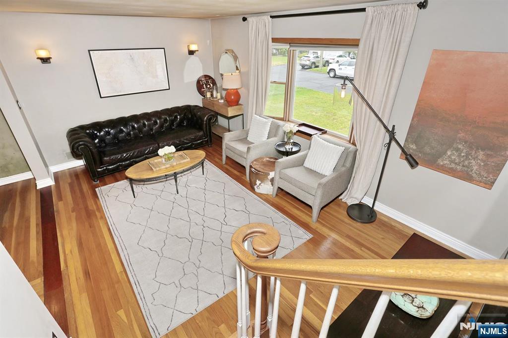 87 Barbara Road Dumont, NJ 07628 - Photo 8 of 48 a living room with furniture and a window