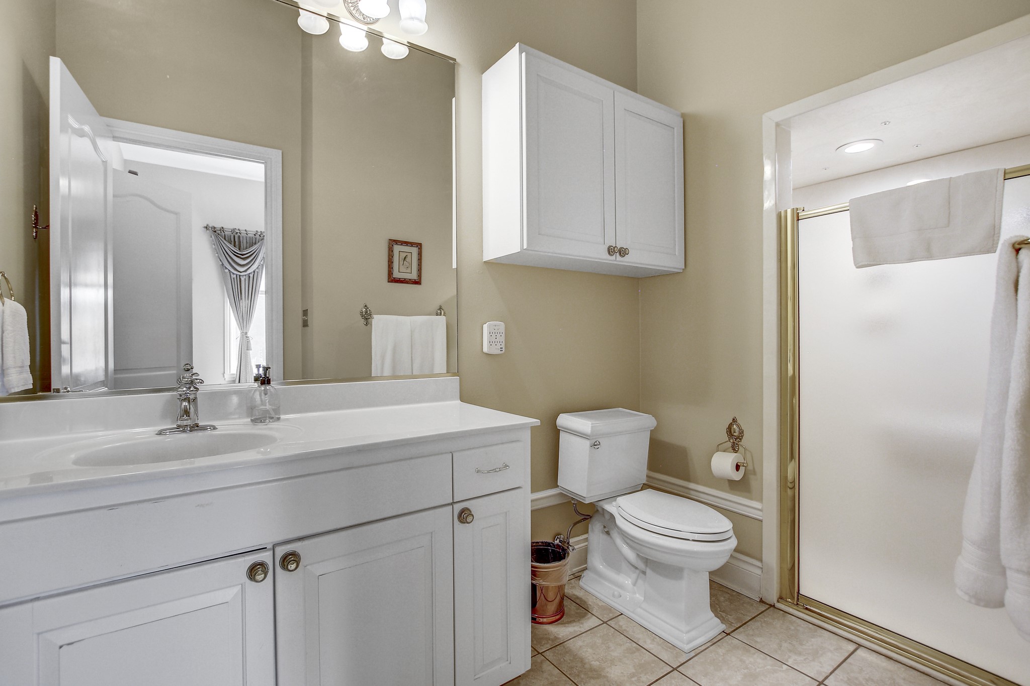 13628 Gregg Manor Road Manor, TX 78653 - Photo 24 of 33 a bathroom with a sink toilet vanity and mirror