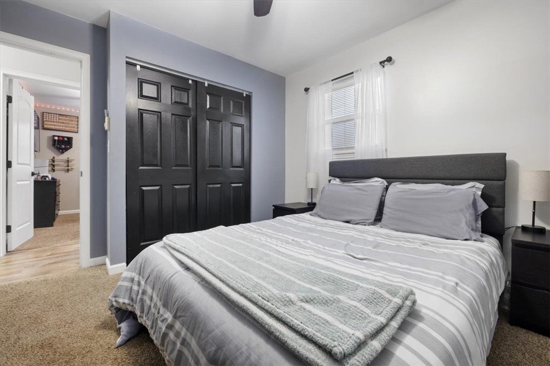 1482 Lee Road Troy, OH 45373 - Photo 17 of 30 This cozy bedroom offers a tranquil retreat with soft lighting and ample storage space.