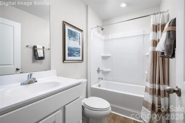 a bathroom with a sink toilet tub and shower