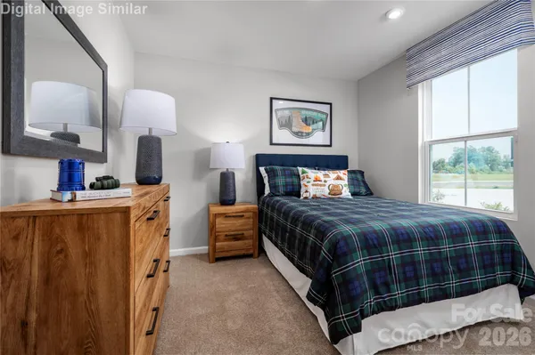 a bedroom with bed and window