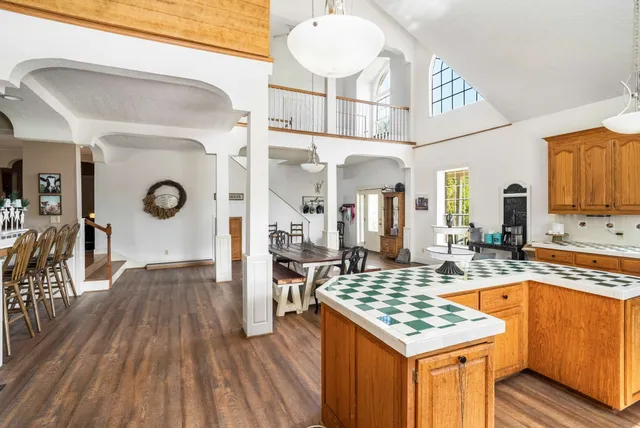 a living room with furniture a wooden floor and a table