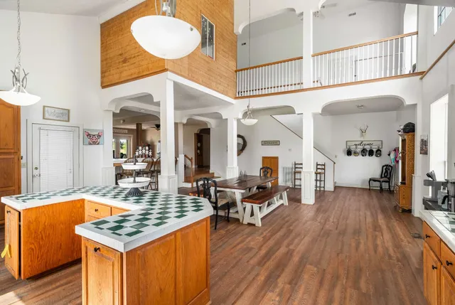 a bedroom with two beds and a chandelier