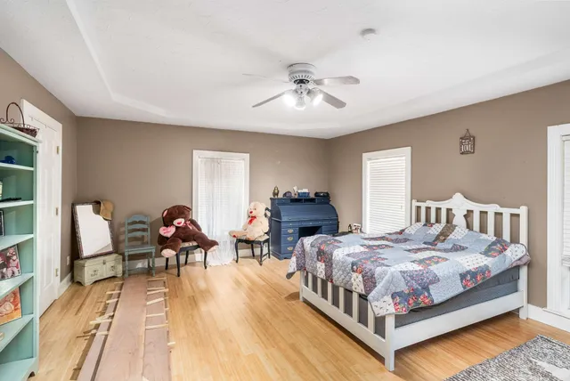 a bathroom with a bathtub sink and mirror