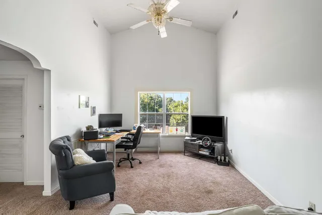 a view of a swimming pool with a yard