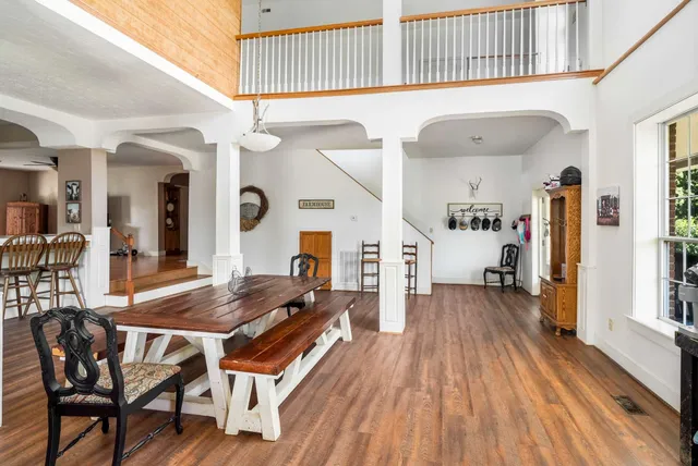 a large kitchen with a table and chairs