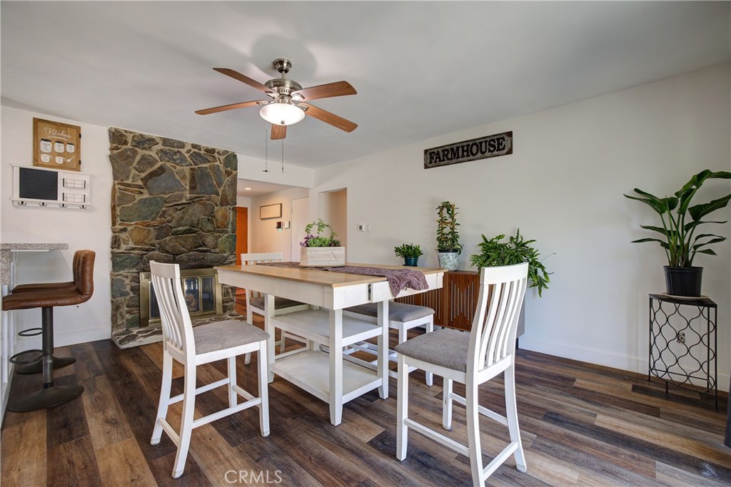 1140 North Belden Avenue Rialto, CA 92376 - Photo 15 of 37 a dining room with furniture potted plants and wooden floor