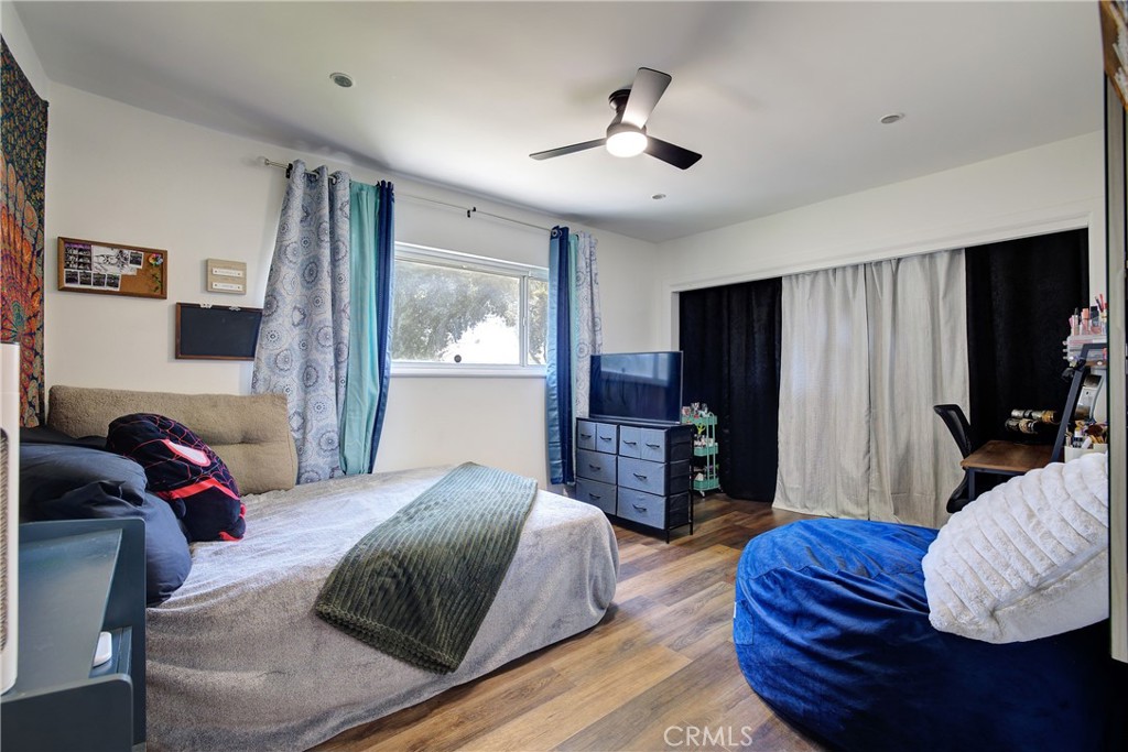1140 North Belden Avenue Rialto, CA 92376 - Photo 18 of 37 a bedroom with a bed and a television