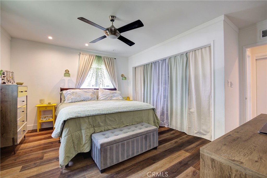 1140 North Belden Avenue Rialto, CA 92376 - Photo 20 of 37 a bed sitting in a spacious bedroom next to a window