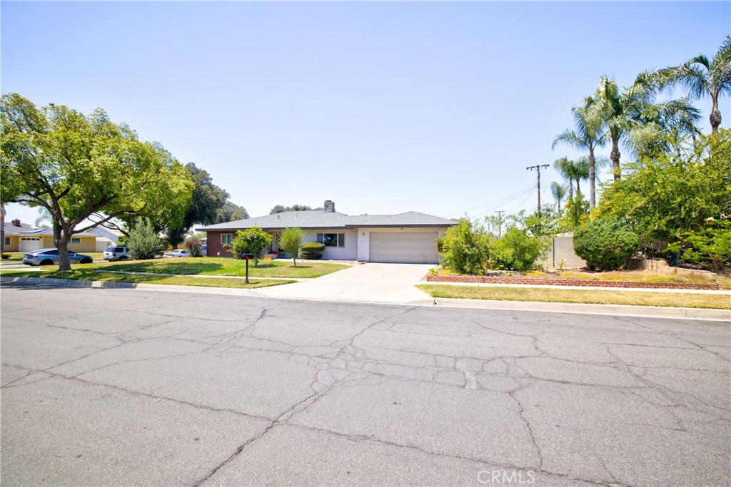 1140 North Belden Avenue Rialto, CA 92376 - Photo 2 of 37 a view of backyard with swimming pool and green space