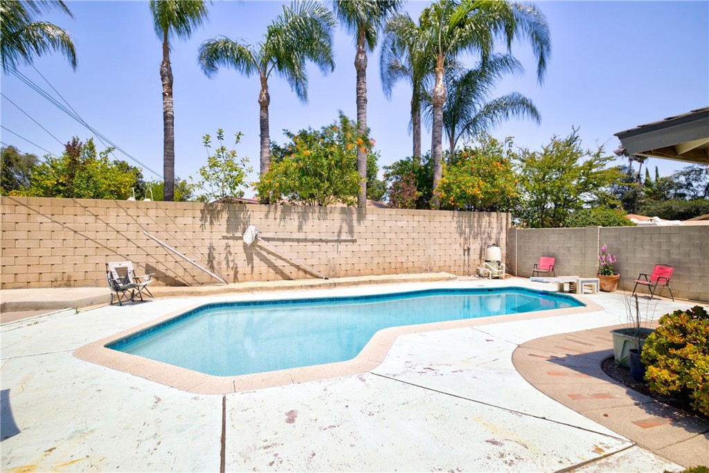 1140 North Belden Avenue Rialto, CA 92376 - Photo 29 of 37 a view of a swimming pool with an outdoor space