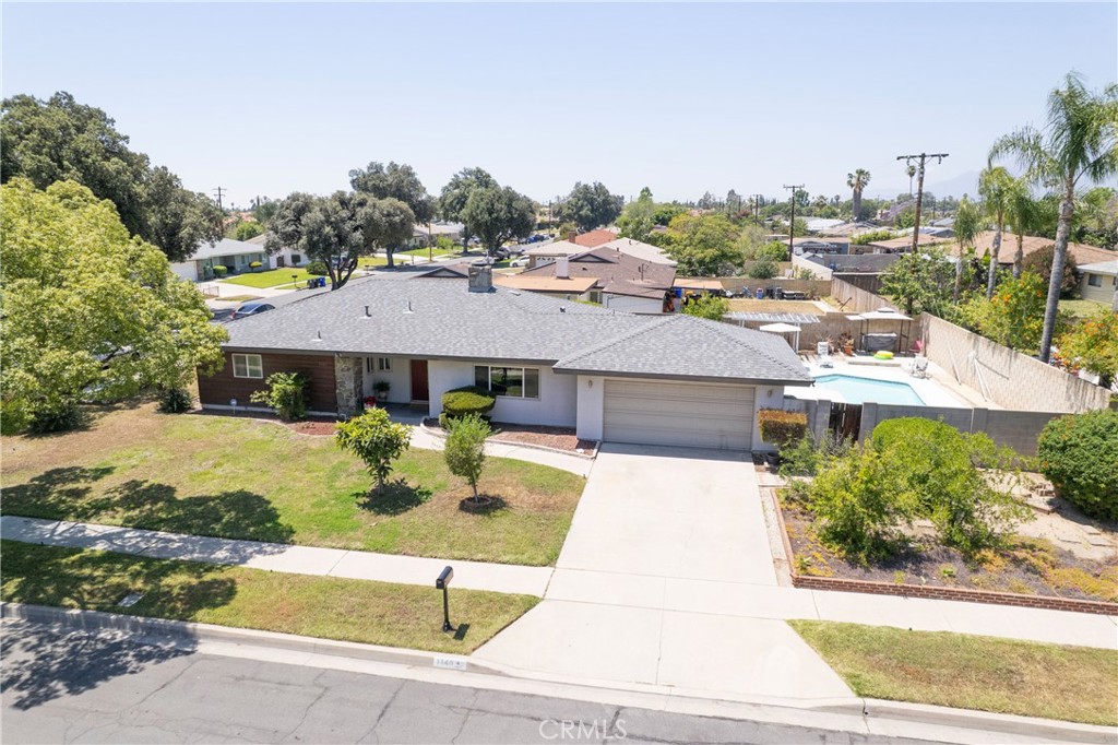 1140 North Belden Avenue Rialto, CA 92376 - Photo 32 of 37 a view of a white house with a yard