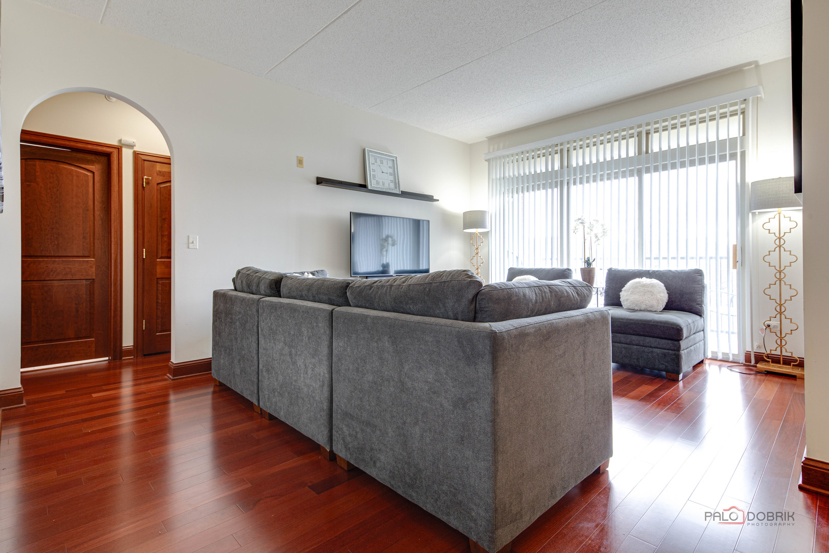 720 Prestwick Lane, Unit 302 Wheeling, IL 60090 - Photo 11 of 23 a living room with furniture and a large window