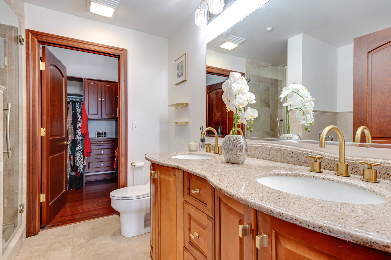 720 Prestwick Lane, Unit 302 Wheeling, IL 60090 - Photo 14 of 23 a bathroom with a granite countertop sink a toilet and a mirror
