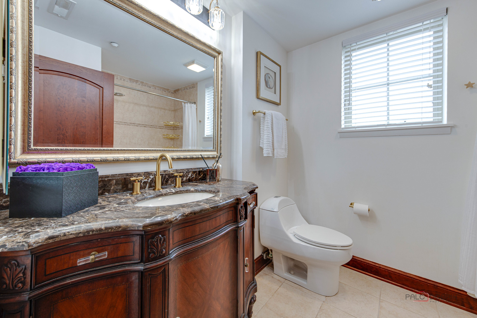 720 Prestwick Lane, Unit 302 Wheeling, IL 60090 - Photo 17 of 23 a bathroom with a granite countertop toilet a sink and a mirror