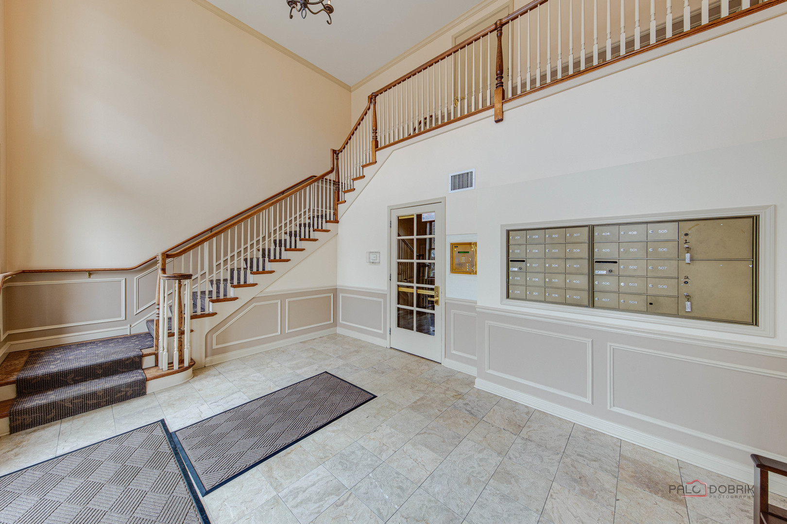720 Prestwick Lane, Unit 302 Wheeling, IL 60090 - Photo 18 of 23 a view of staircase with white walls and a window