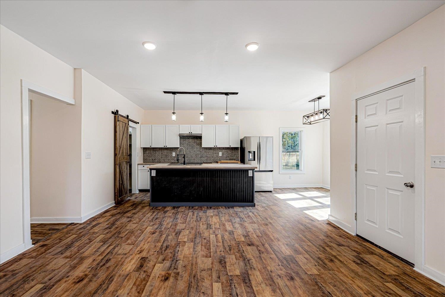 245 Ecology Loop Eads, TN 38028 - Photo 8 of 23 a large kitchen with a refrigerator and a stove