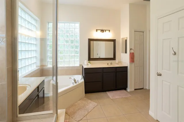 a bedroom with a bed and a tv