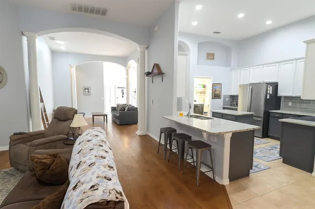 a living room with furniture and a large window