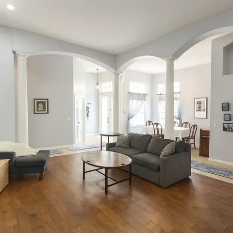 a kitchen with sink refrigerator and microwave