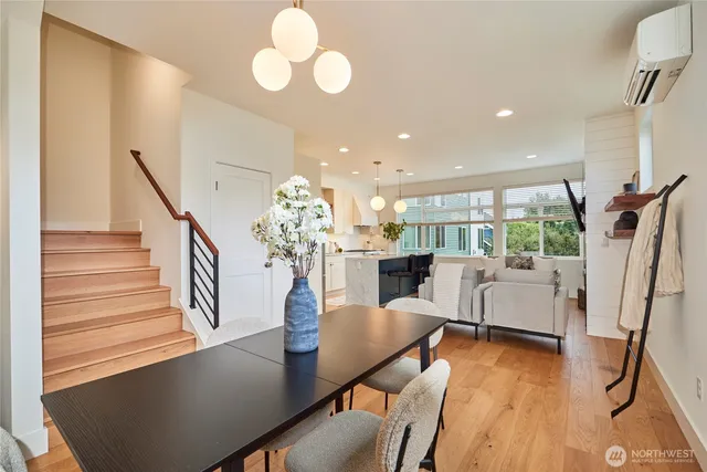 a view of a dining room with furniture wooden floor and chandelier