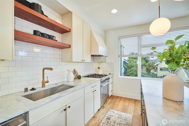 a kitchen with a sink and a stove