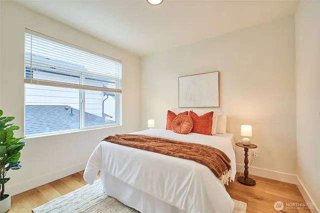 a bedroom with a bed and window