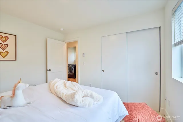 a bedroom with a bed and a walk in closet