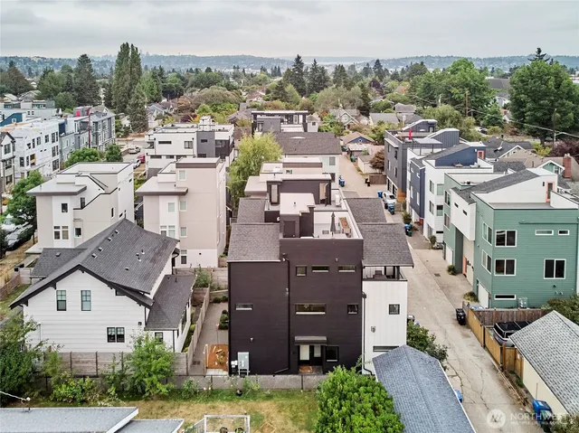 an aerial view of a residential apartment building with a yard