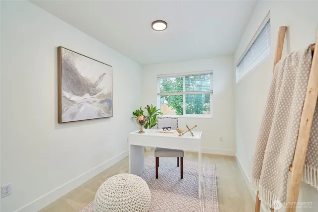 a workspace with furniture and a window