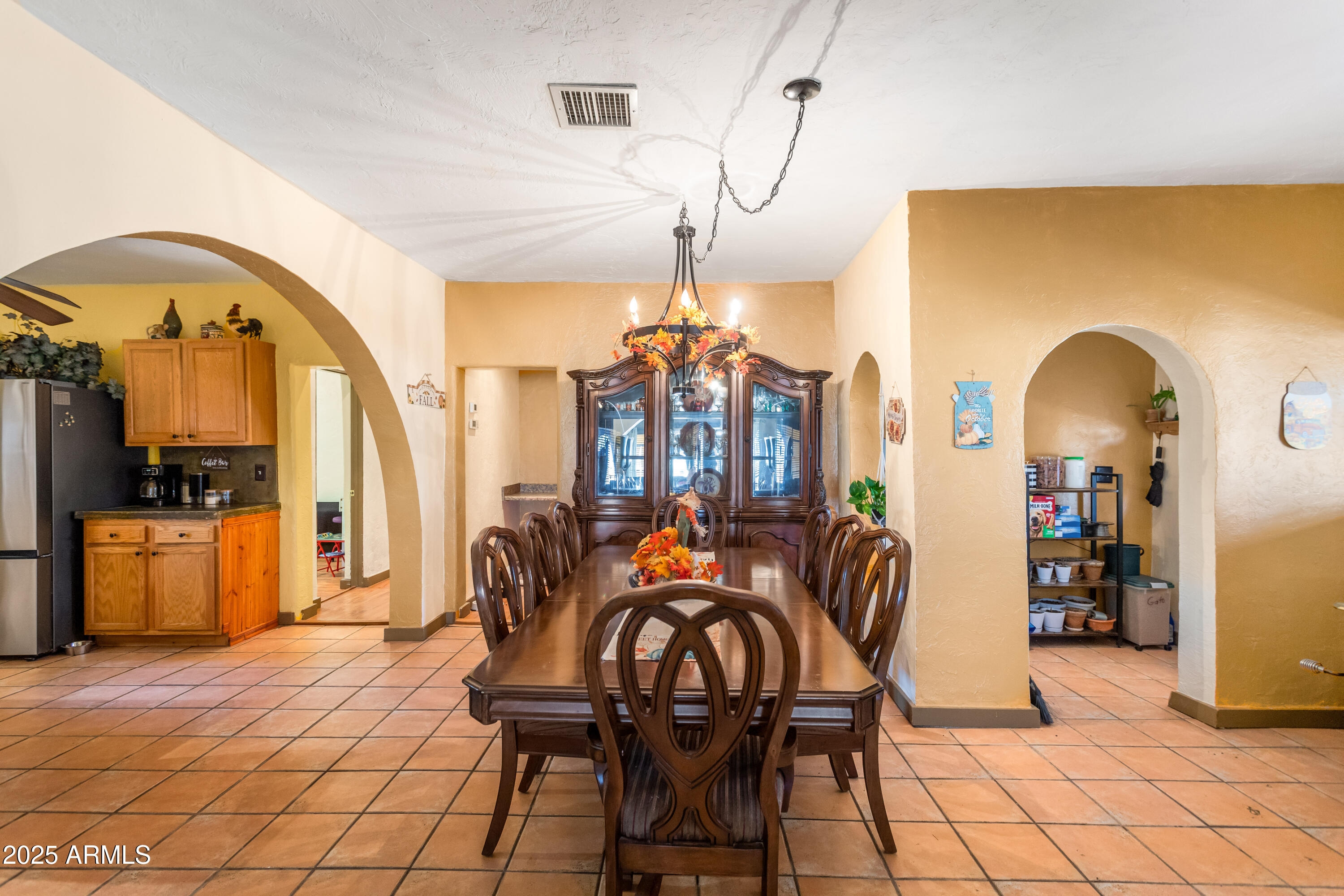 4181 West Double Adobe Road McNeal, AZ 85617 - Photo 11 of 41 a dining room with furniture and chandelier kitchen view