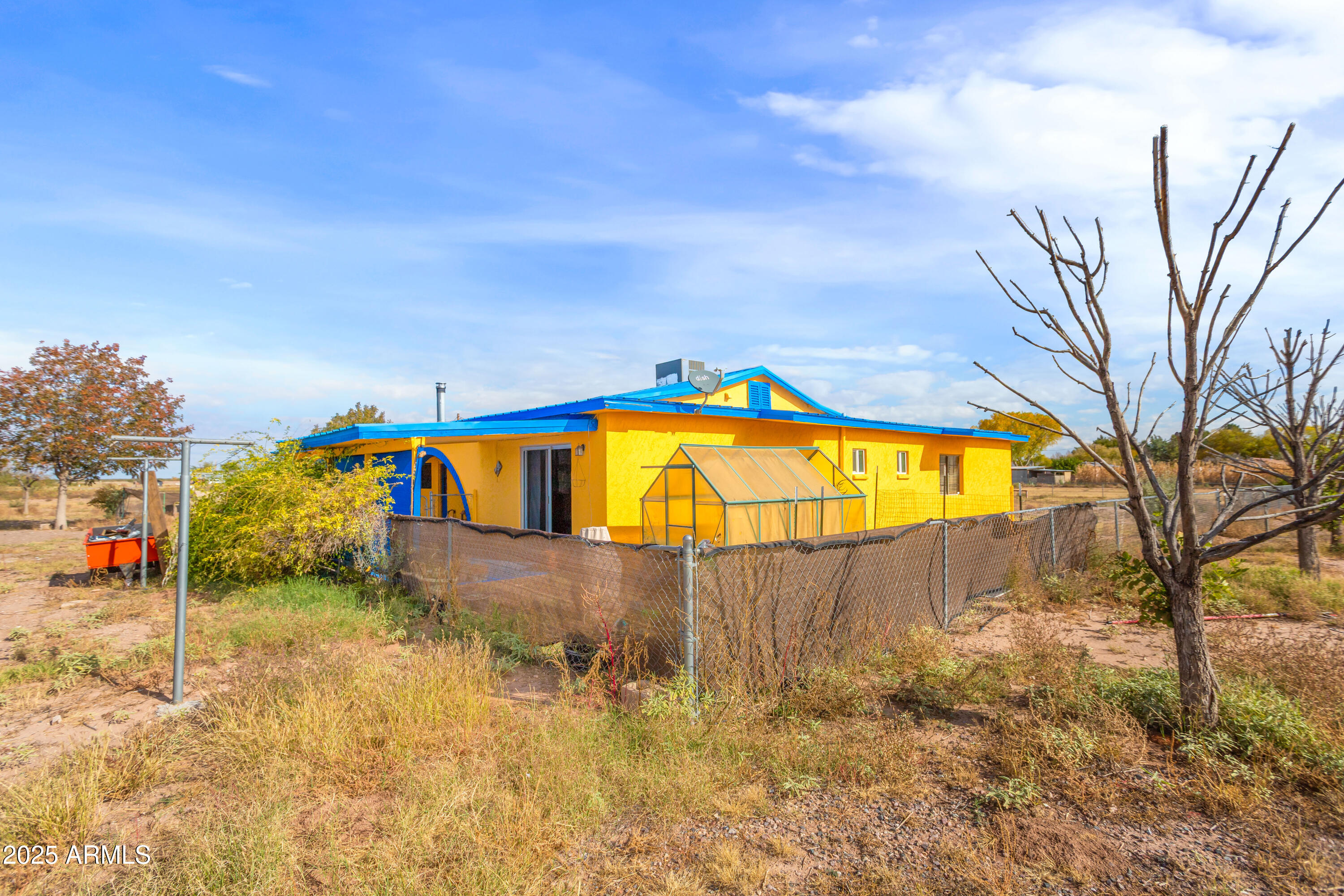 4181 West Double Adobe Road McNeal, AZ 85617 - Photo 32 of 41 a view of a swimming pool with a yard