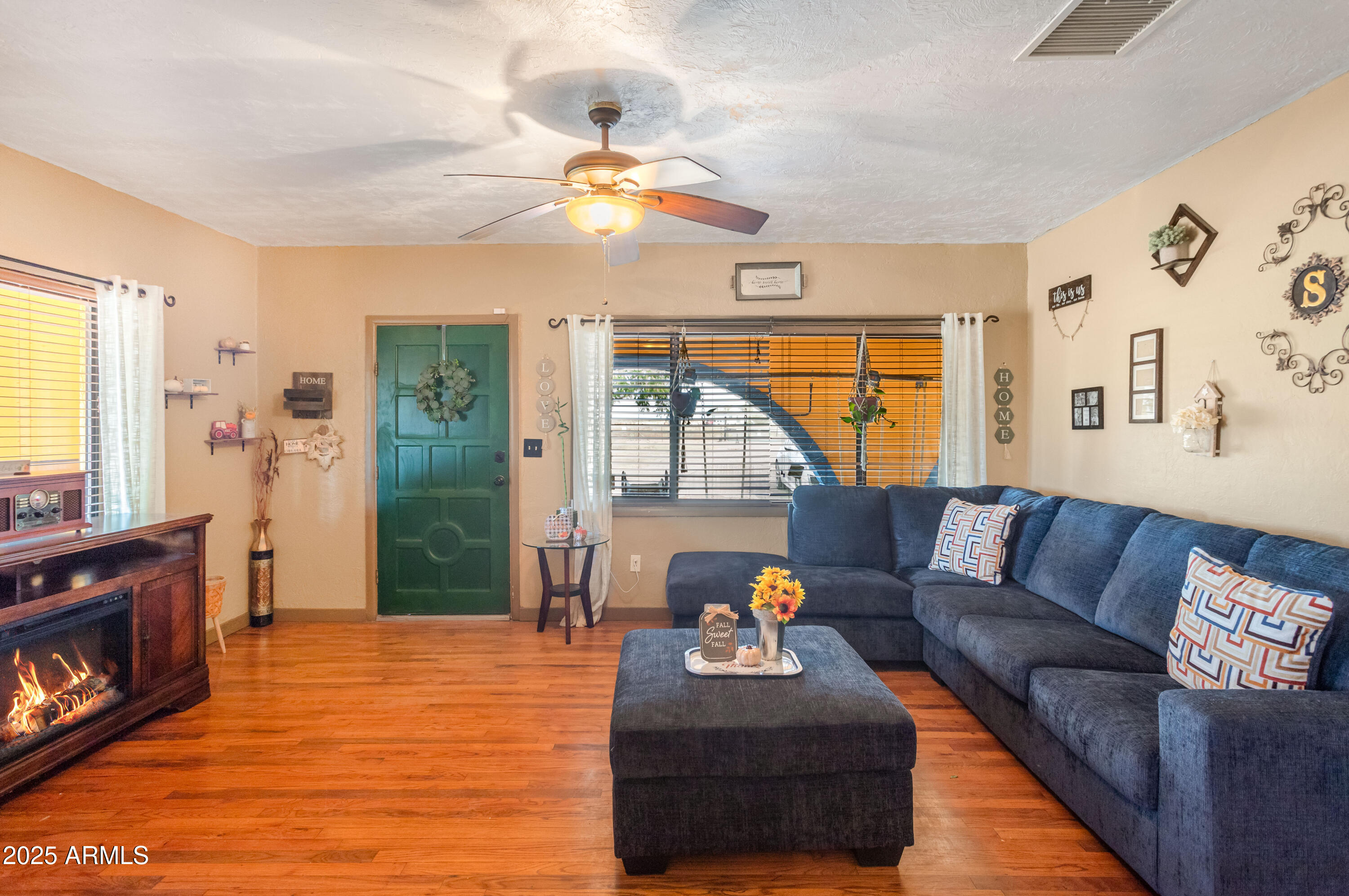 4181 West Double Adobe Road McNeal, AZ 85617 - Photo 10 of 41 a living room with furniture and a flat screen tv